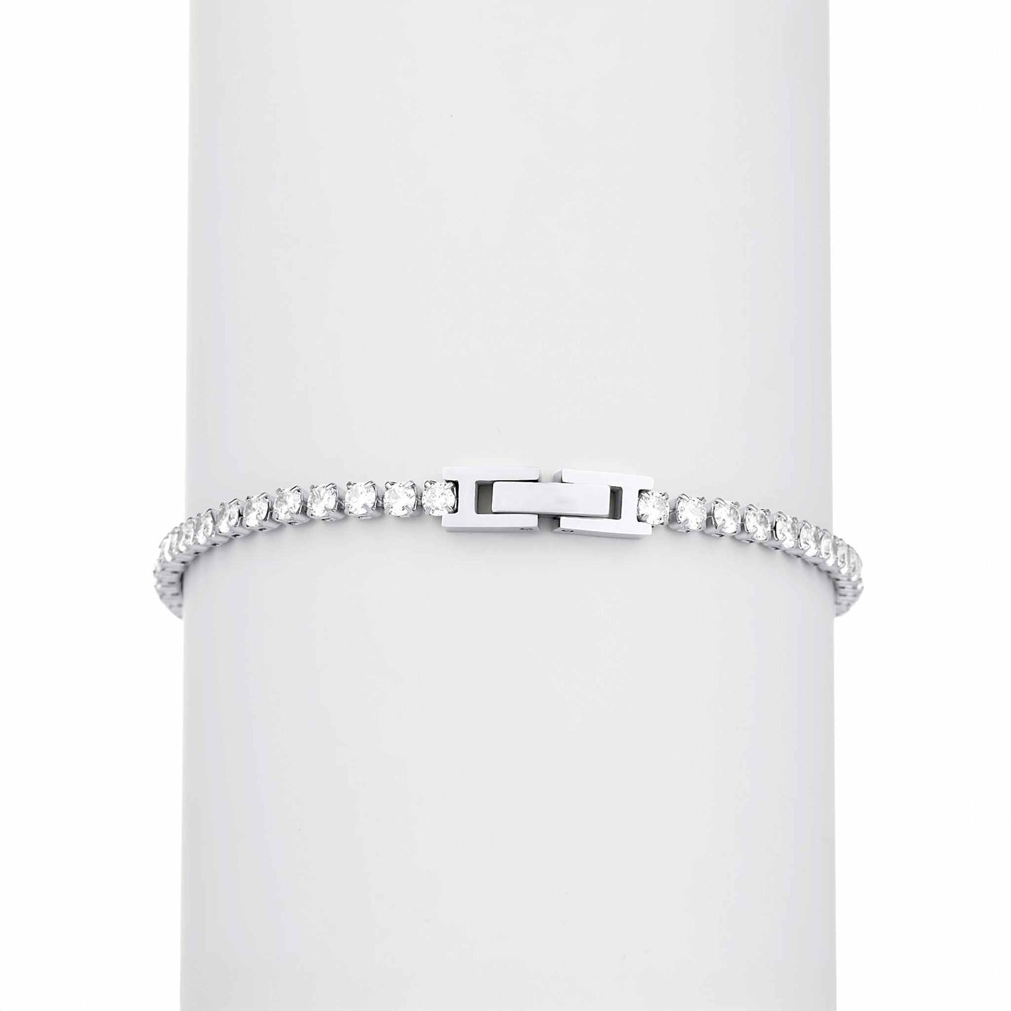 Silver bracelet with clear stones on a white background