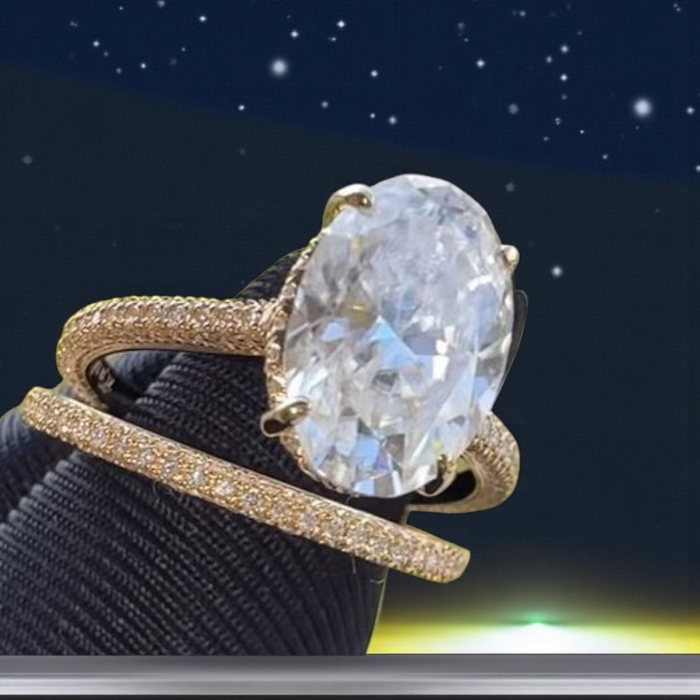 Gold ring with a large diamond on a dark background