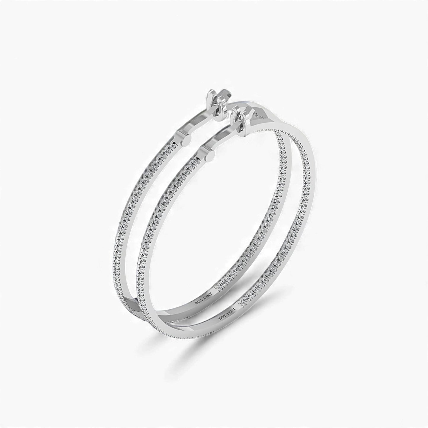 Silver hoop earring on a white background
