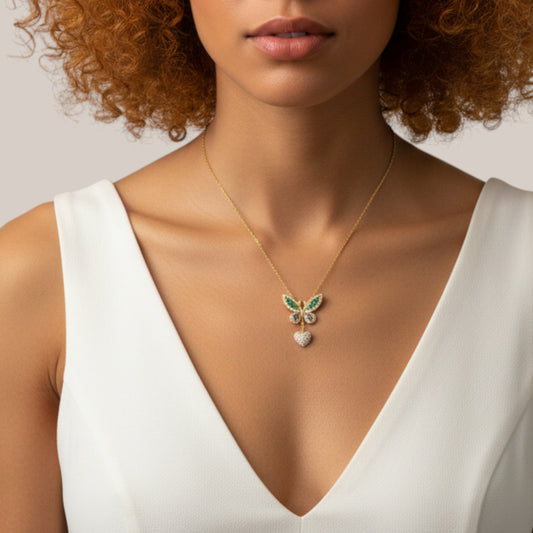 Woman wearing a gold necklace with a butterfly pendant