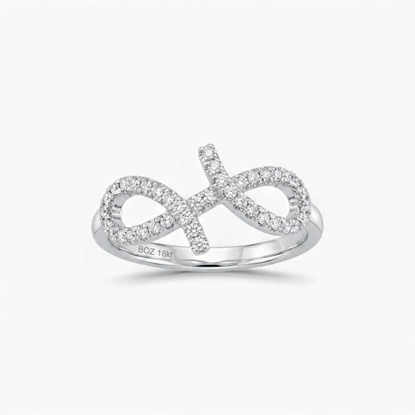 Silver infinity ring with diamonds on a white background