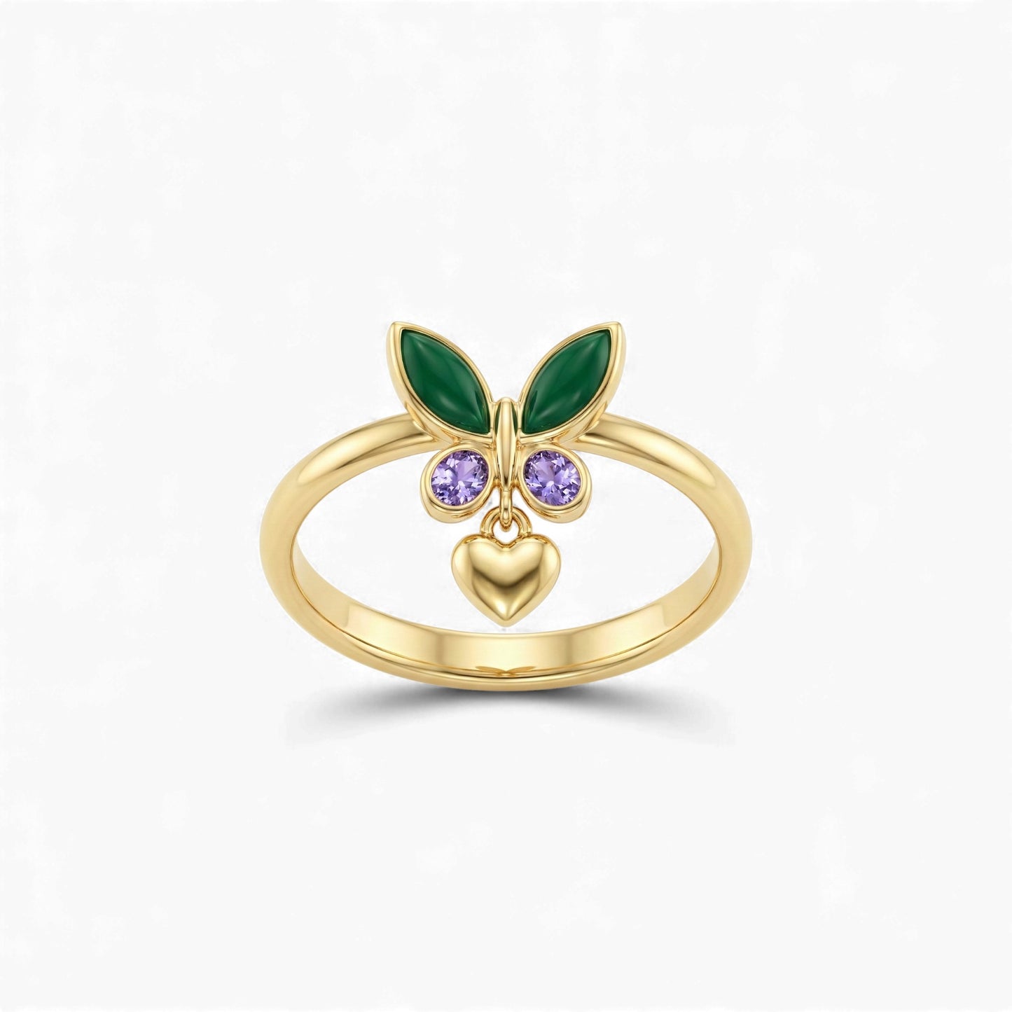Gold ring with green leaves, purple gemstones, and a heart on a white background
