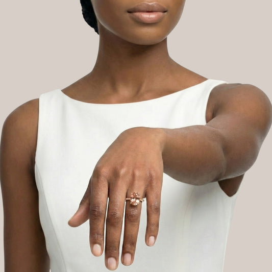 Woman wearing a white sleeveless top with a neutral background