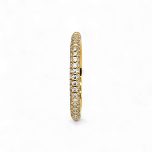 Gold ring with diamond accents on a white background