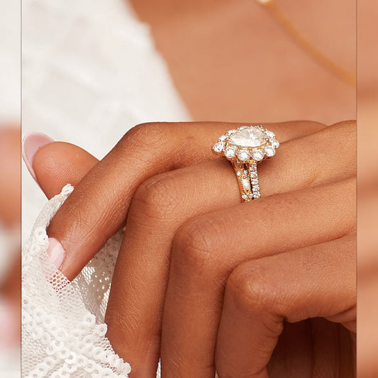 Close-up of a hand wearing a diamond ring with a soft focus background