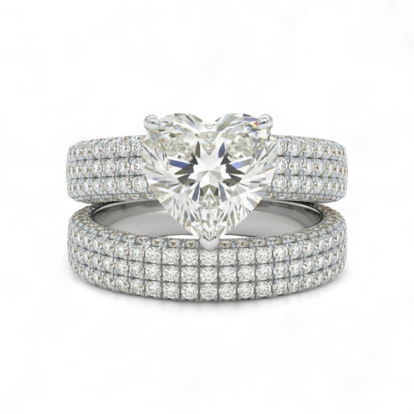 Set of diamond rings with a heart-shaped center stone on a white background