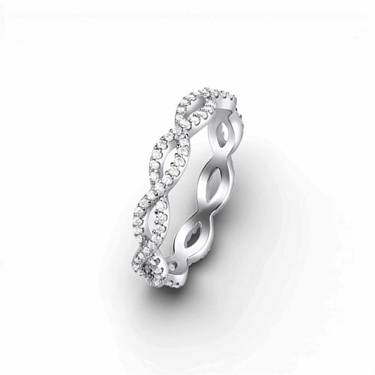 Silver ring with diamond accents on a white background