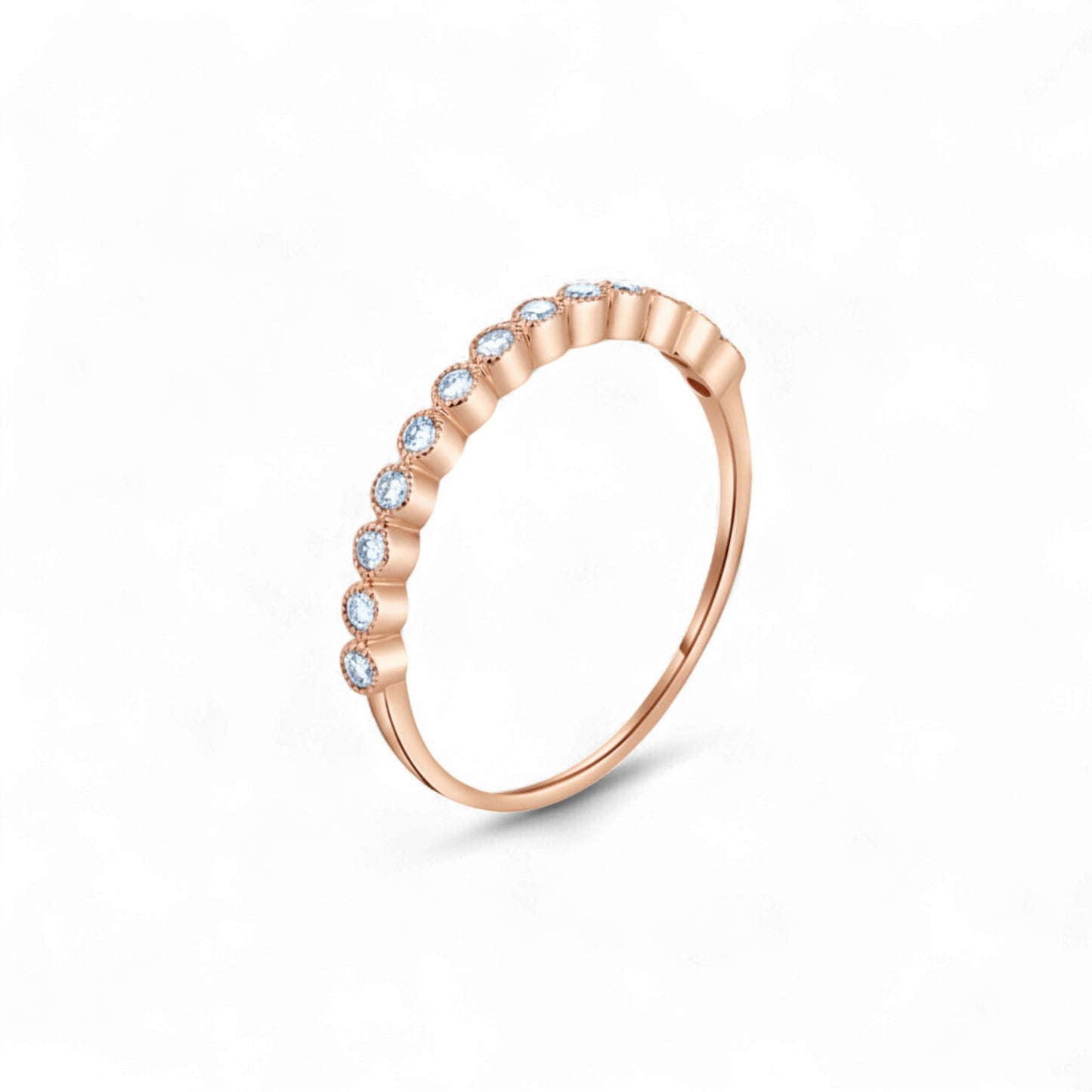 Rose gold ring with small diamonds on a white background
