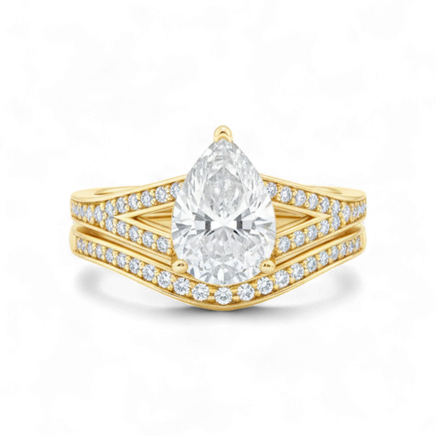 Gold ring with a pear-shaped diamond on a white background