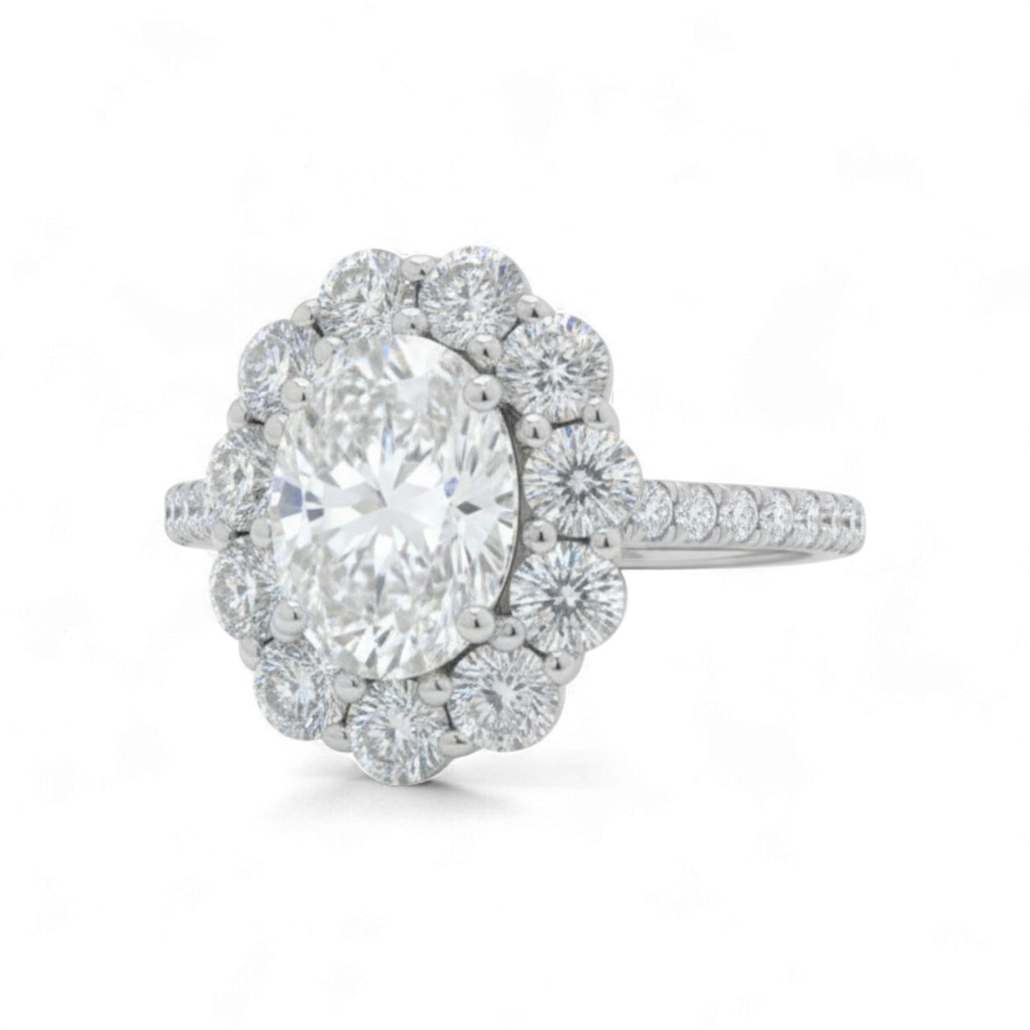 Diamond ring with a large central gemstone and smaller diamonds around on a white background