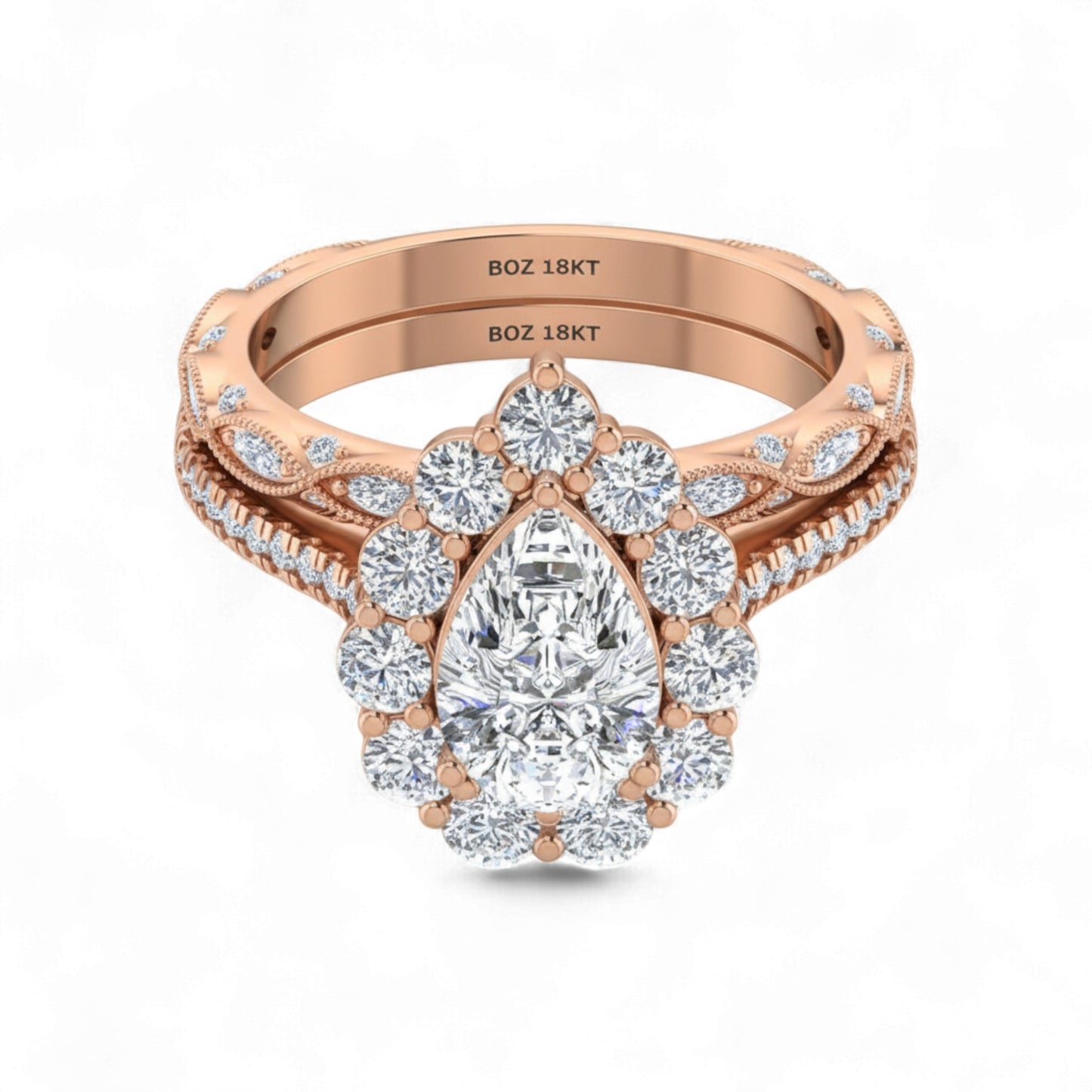Rose gold ring with a pear-shaped diamond on a white background
