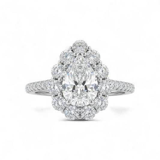Diamond ring with a pear-shaped center stone on a white background