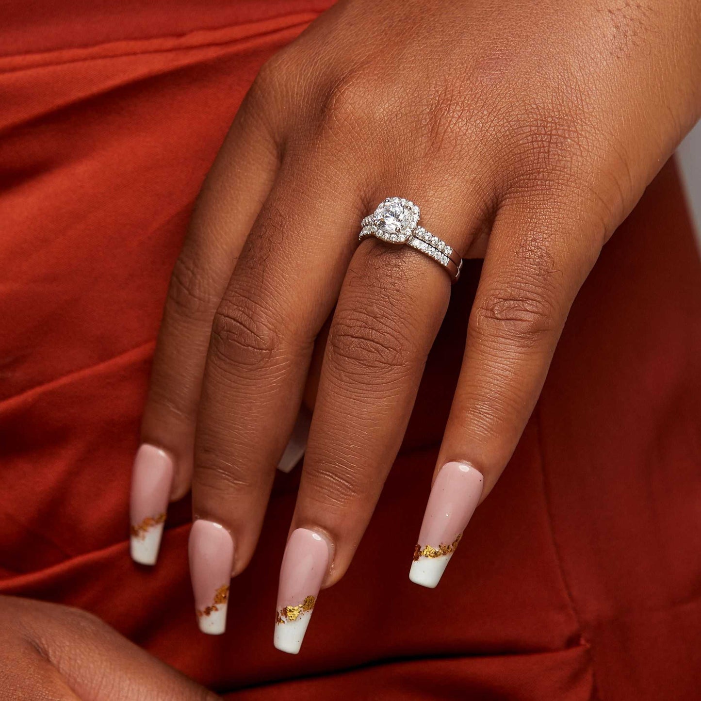 Classic Cushion CZ Sterling Silver Bride Set with cushion-cut cubic zirconia engagement ring and matching CZ wedding band on hand