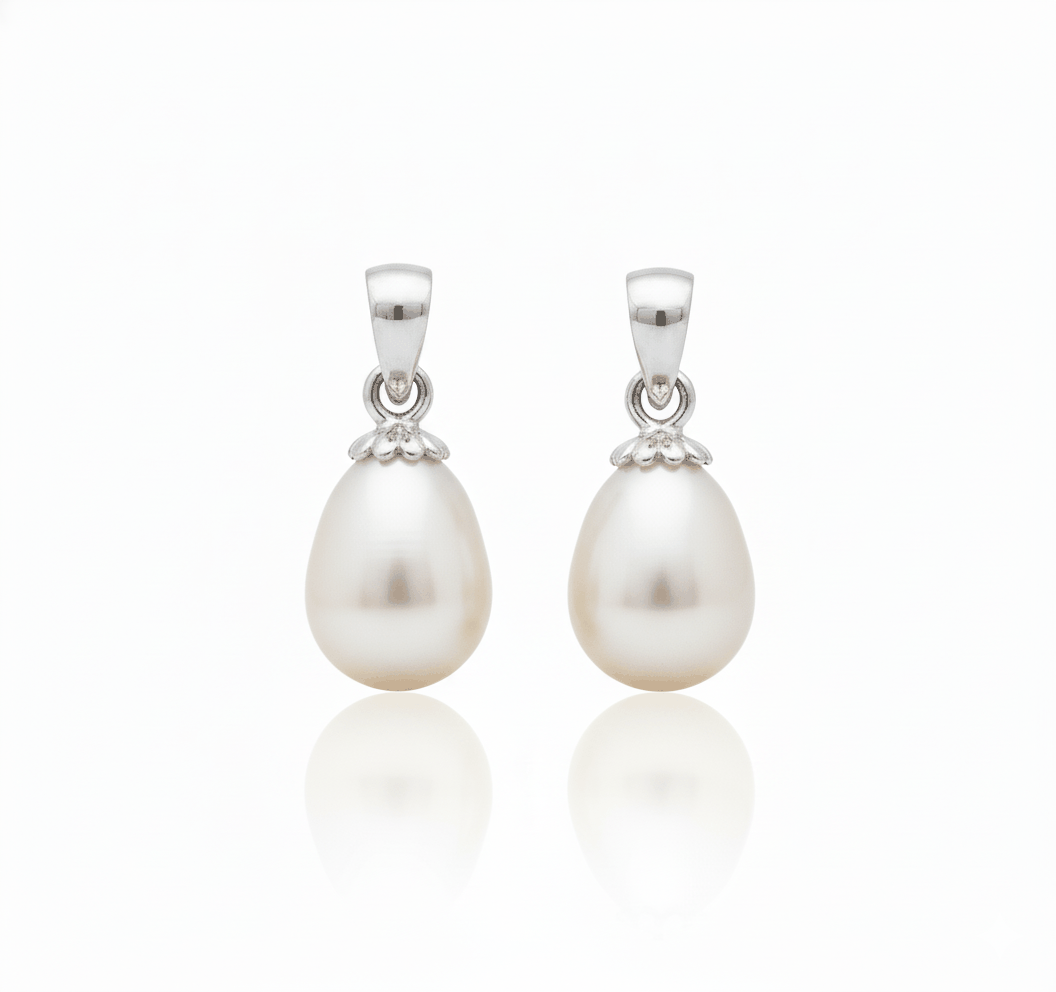 Pair of natural pearl pendants with 18KT gold setting, elegant and minimalist design.