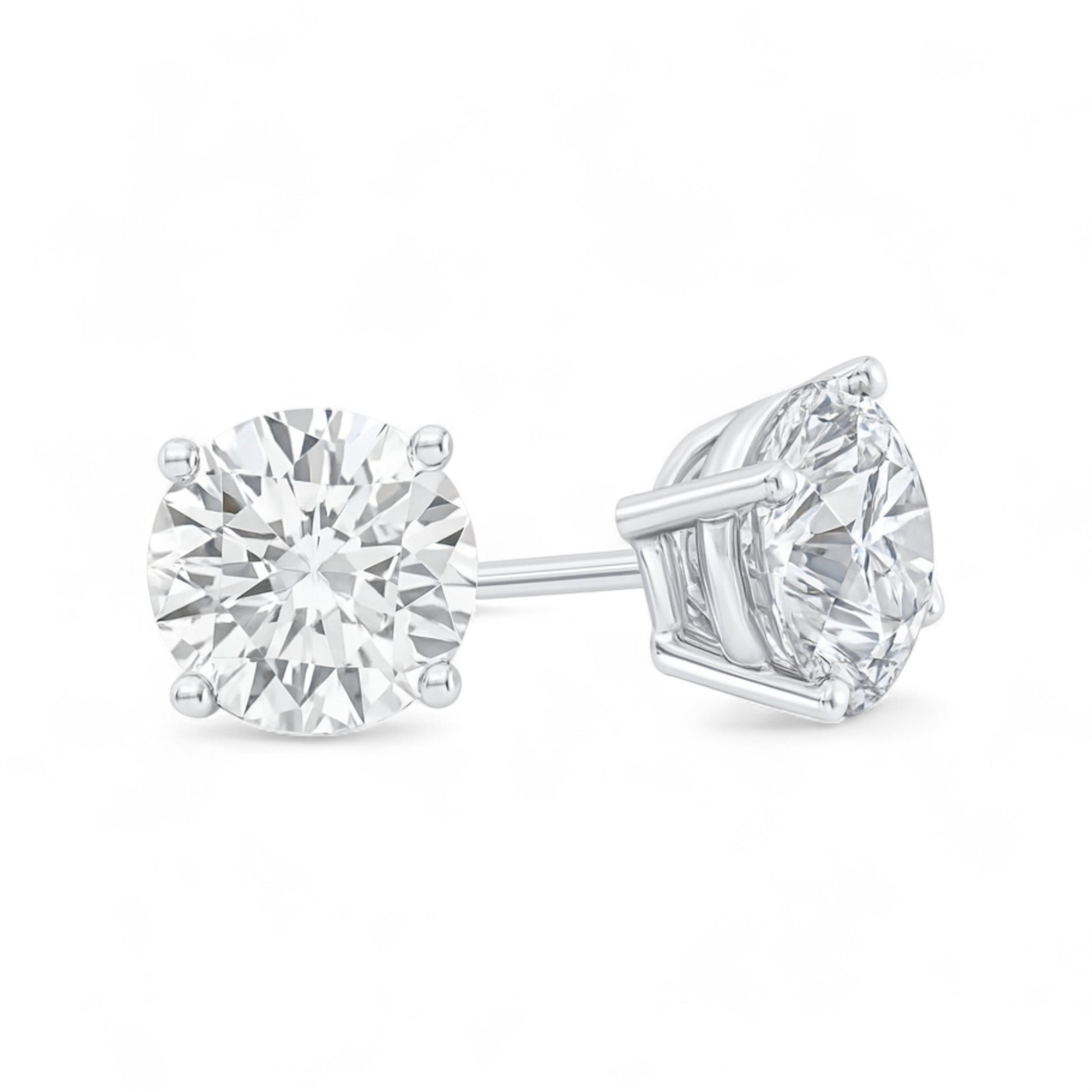Pair of diamond stud earrings on a white background