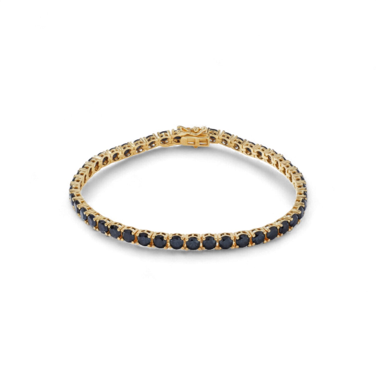 Gold bracelet with black stones on a white background