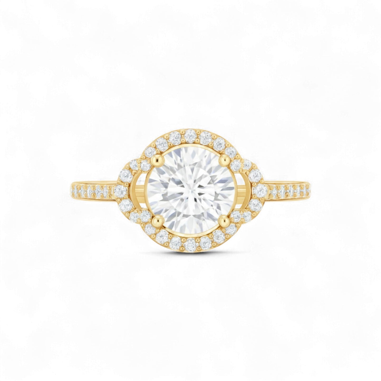 Gold ring with a large diamond and smaller diamonds on the band against a white background