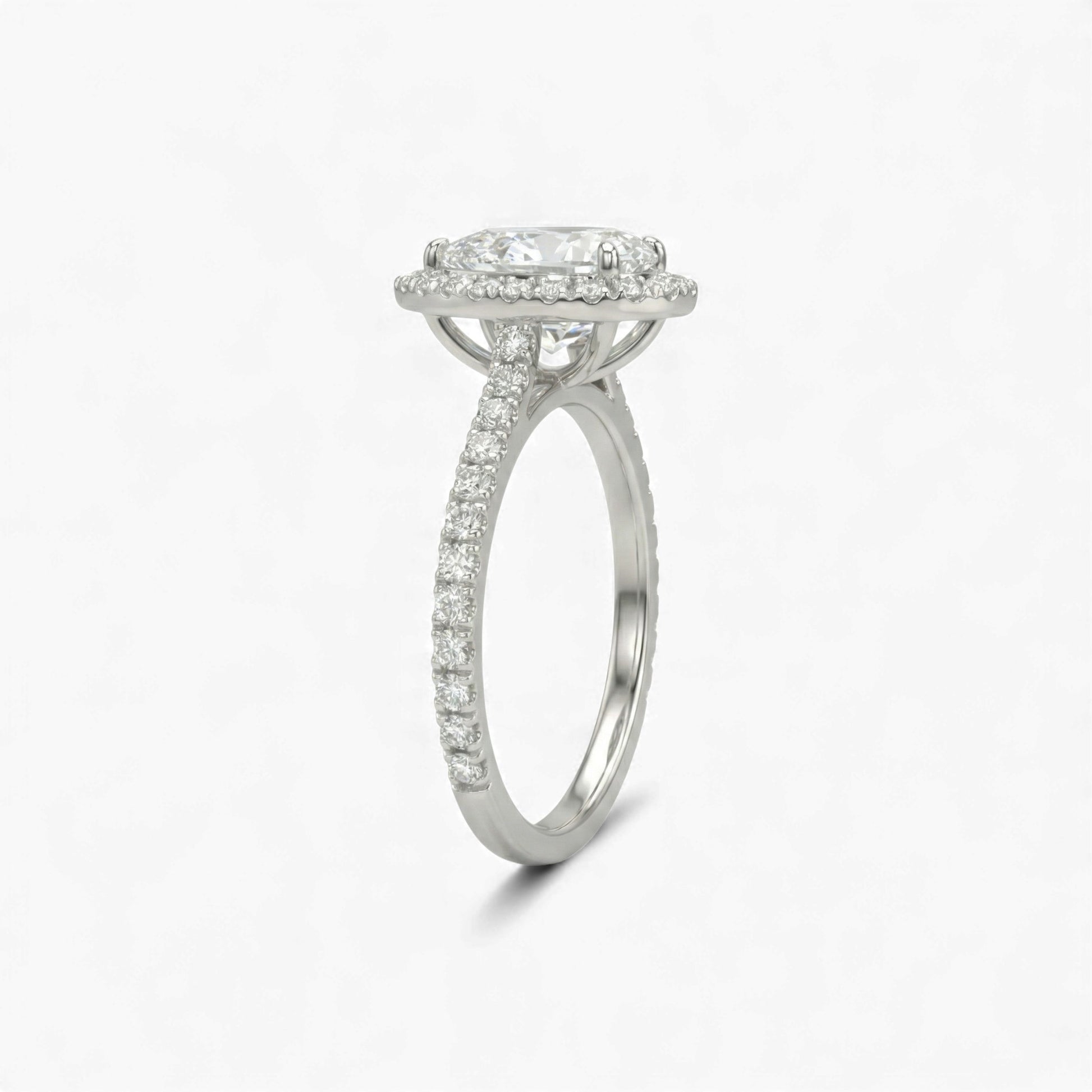 Silver ring with diamond accents on a white background