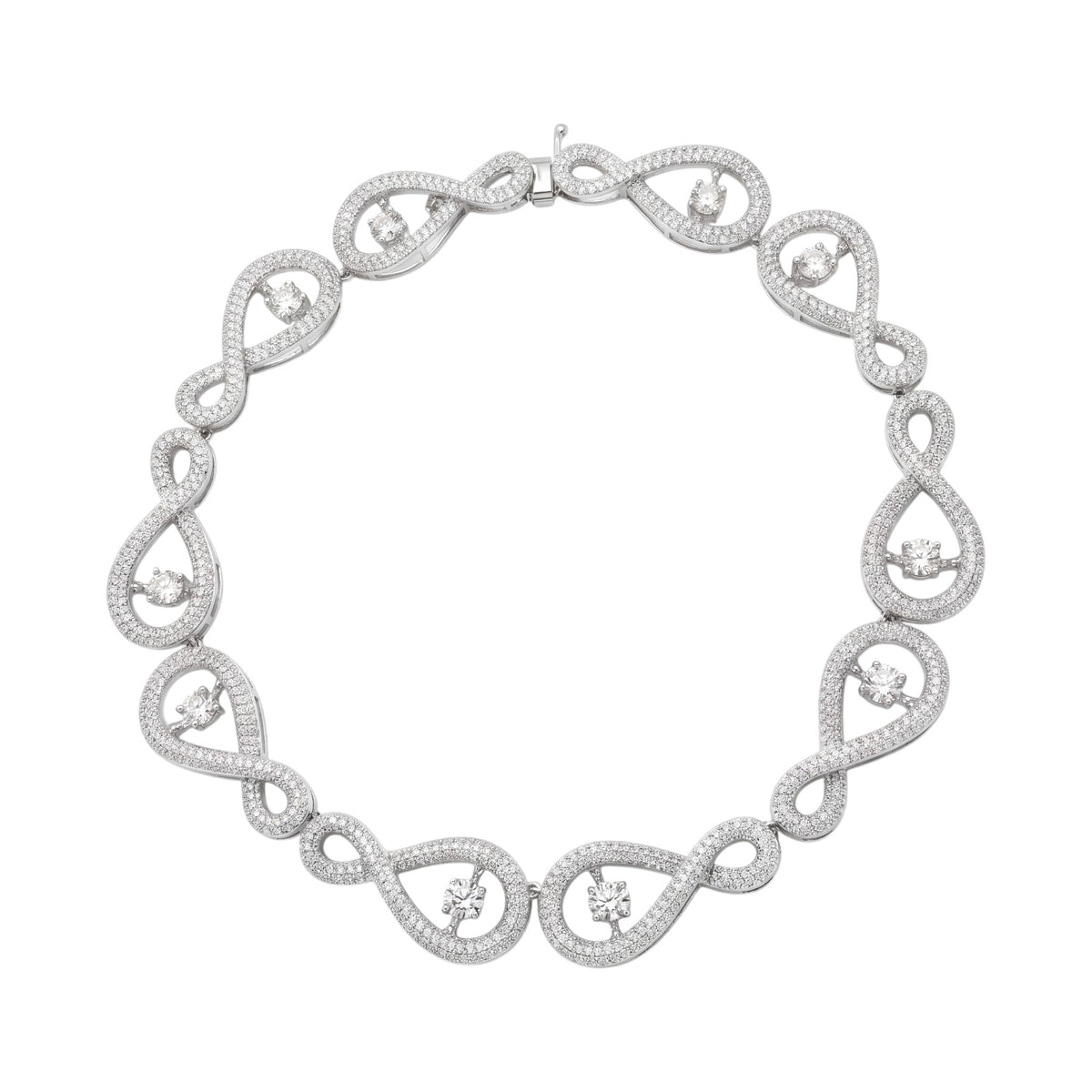 A silver-toned infinity link necklace adorned with small round stones and larger floral motifs, displayed on a clean white background.