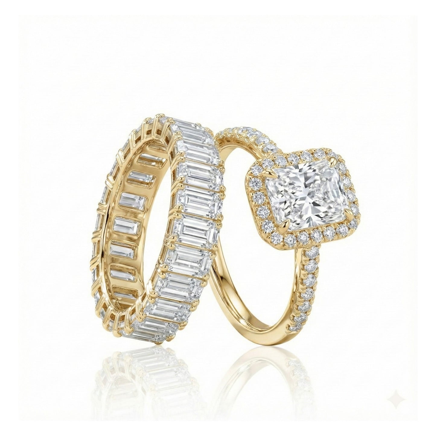 Two gold diamond rings on a white background