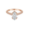 Rose gold ring with a large diamond and smaller diamonds on the band against a white background