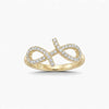 Gold infinity ring with diamonds on a white background