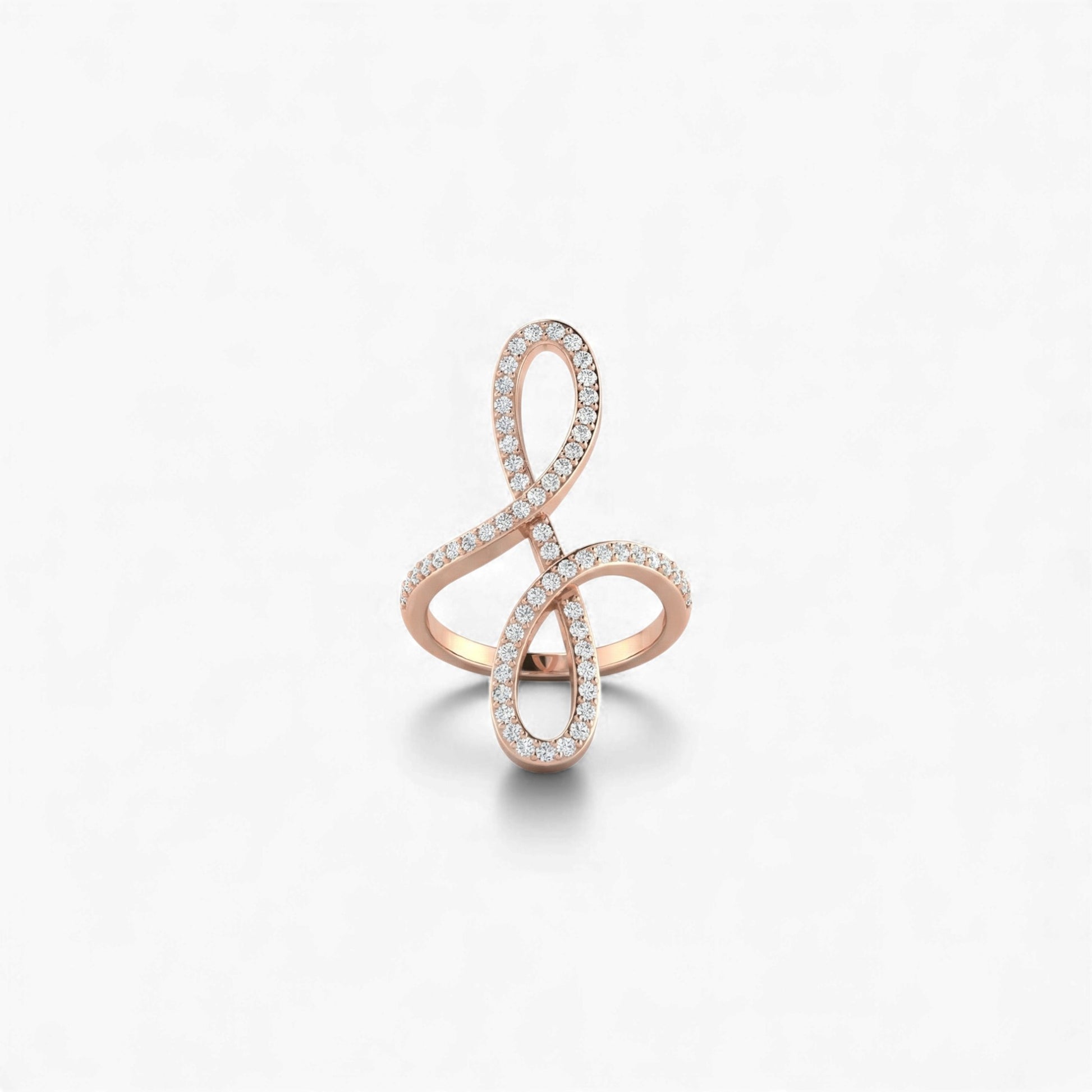 Rose gold ring with diamond accents on a light gray background