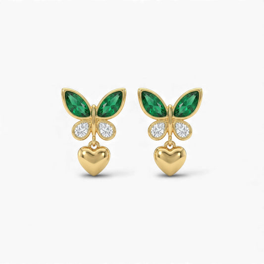 Gold butterfly earrings with green gemstones and heart pendants on a white background