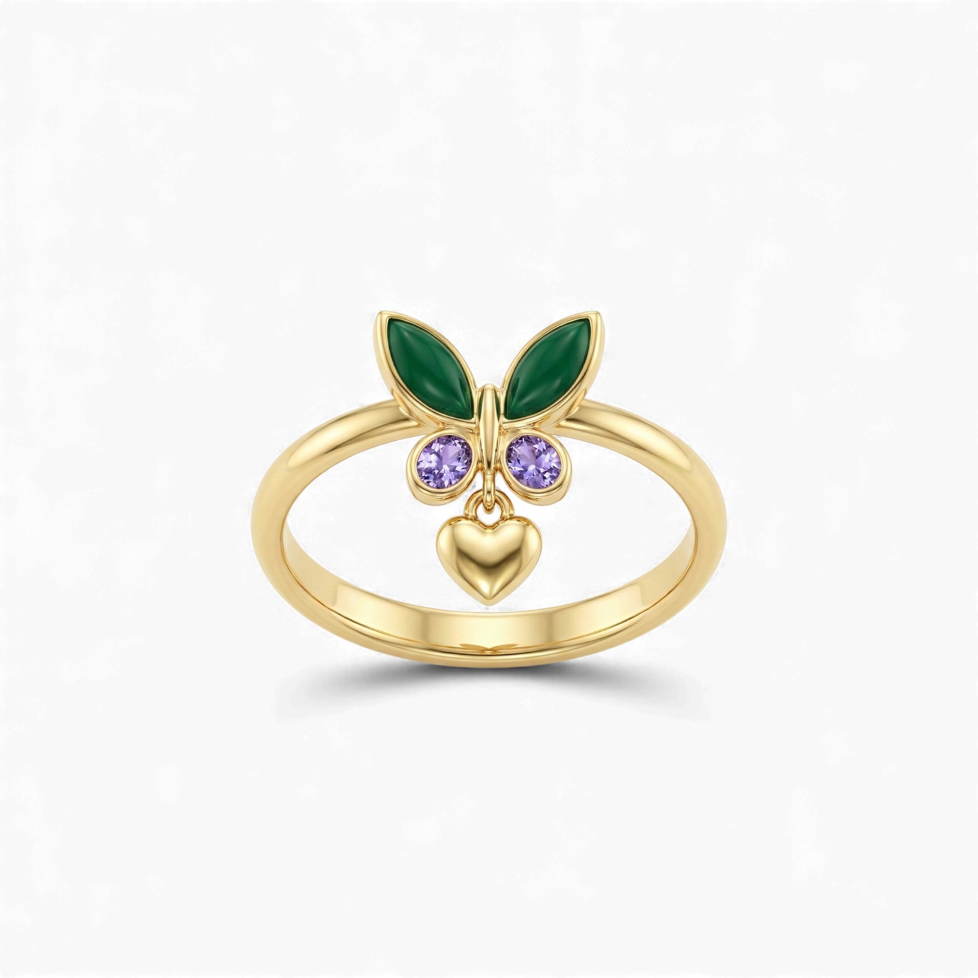 Gold ring with green leaves, purple gemstones, and a heart on a white background
