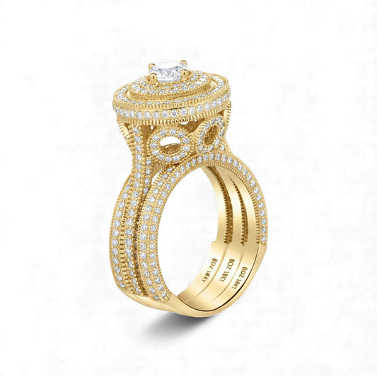 Gold ring with diamond accents on a white background
