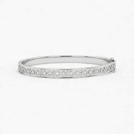 Silver bangle with small stones on a white background