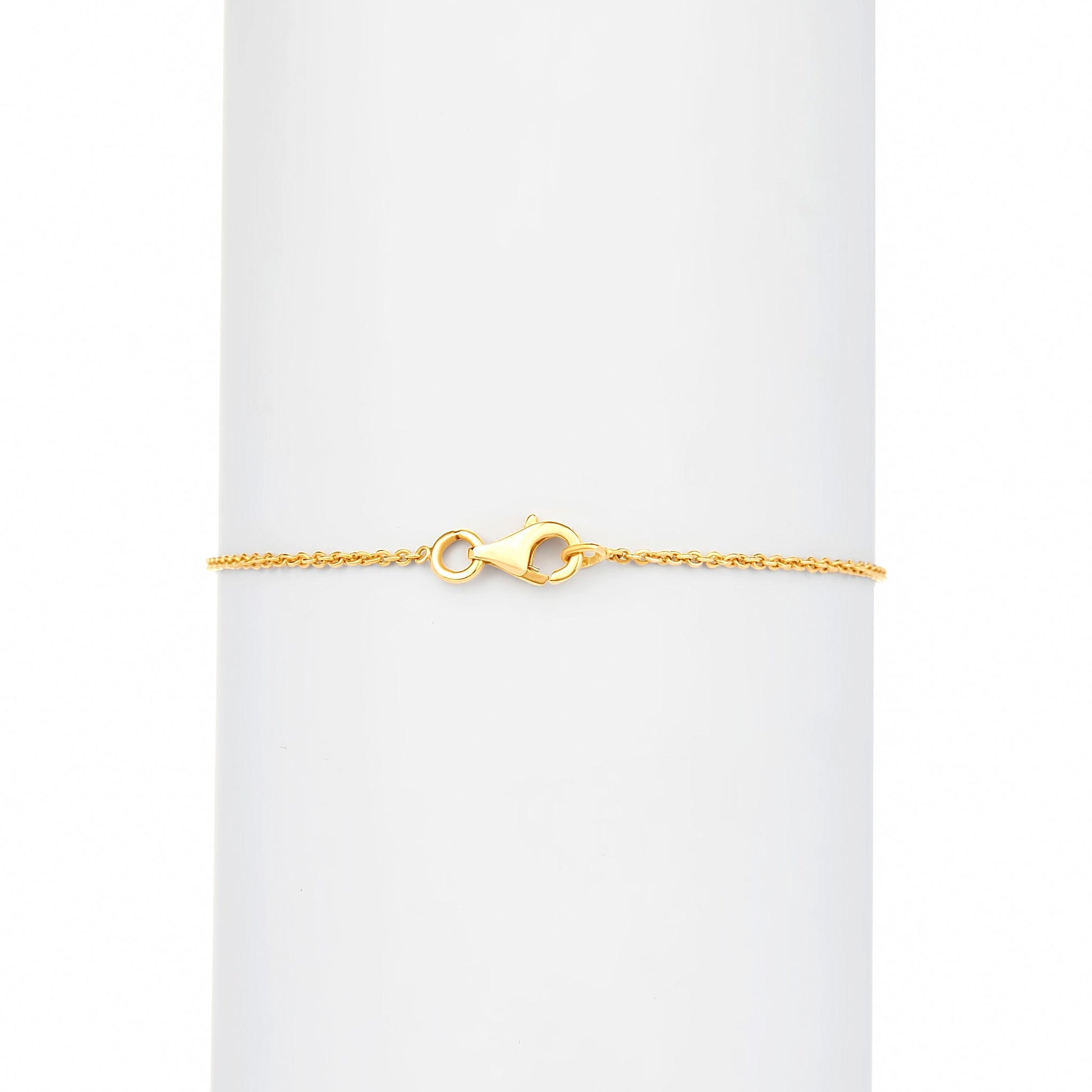Gold bracelet on a white background