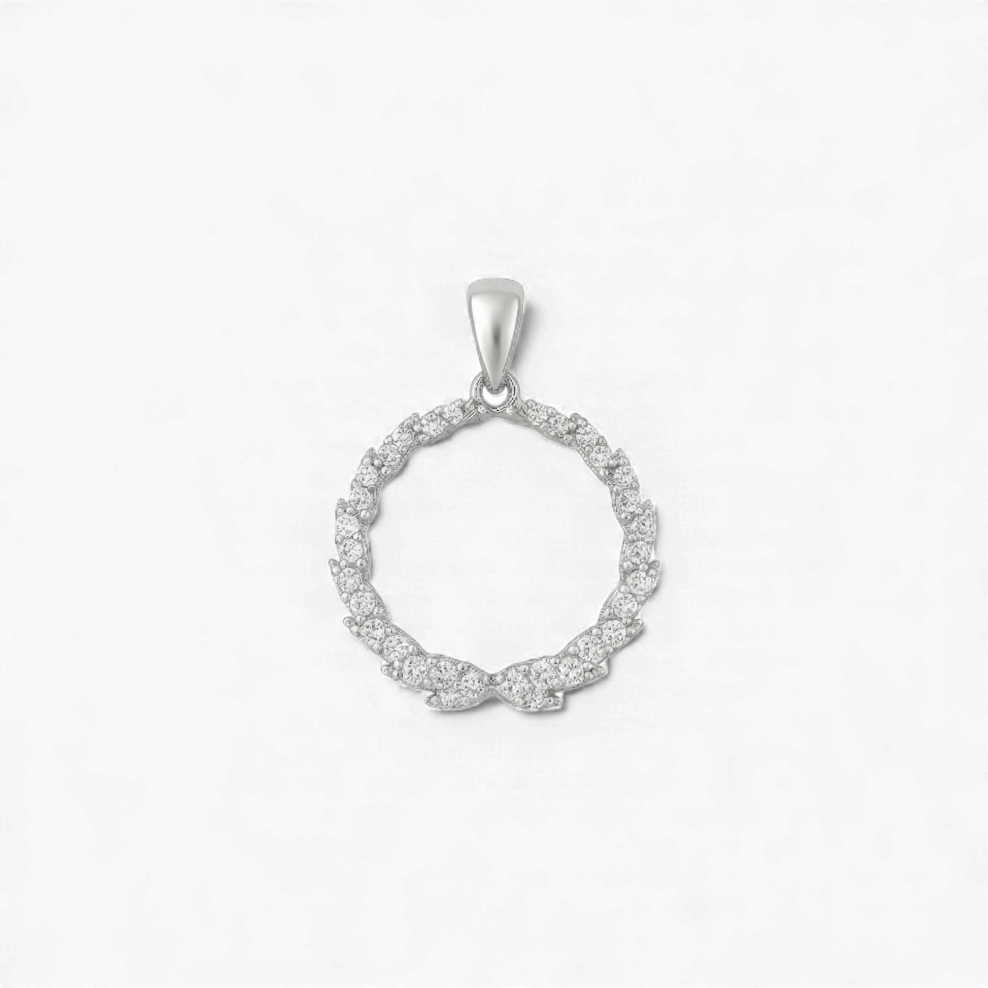 Silver circular pendant with small diamonds on a light gray background