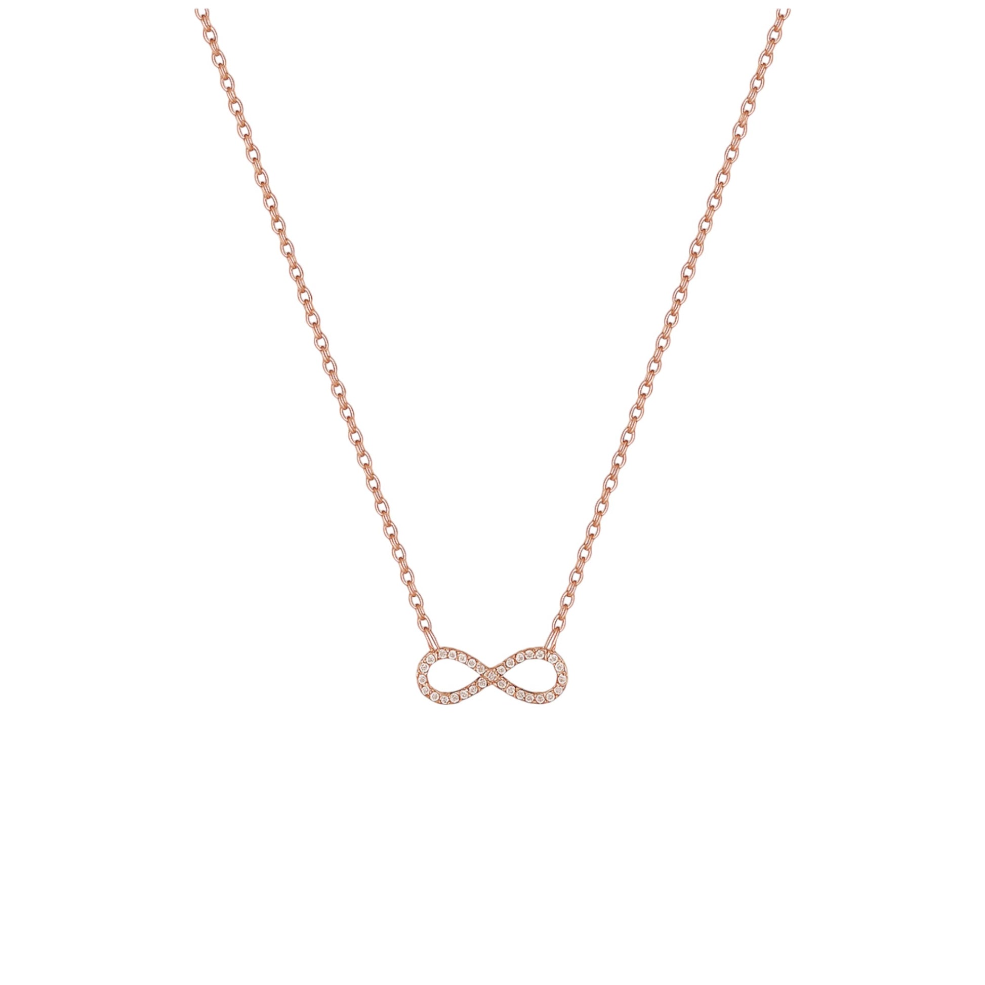 Rose gold infinity necklace on a white background
