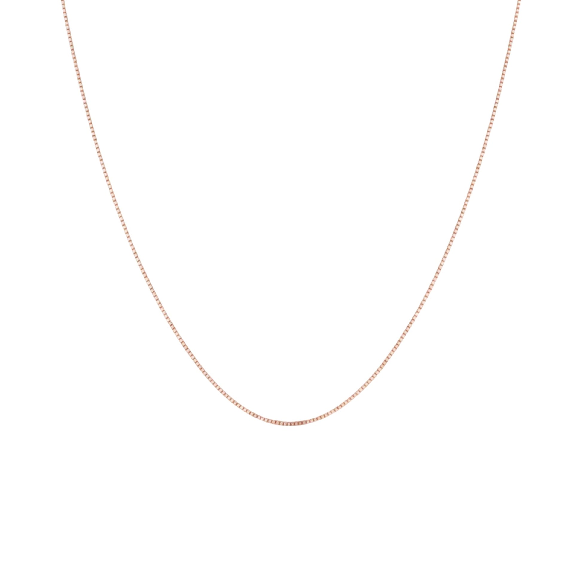 Rose gold chain necklace on a white background