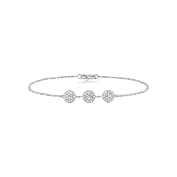 Silver bracelet with three round diamonds on a white background