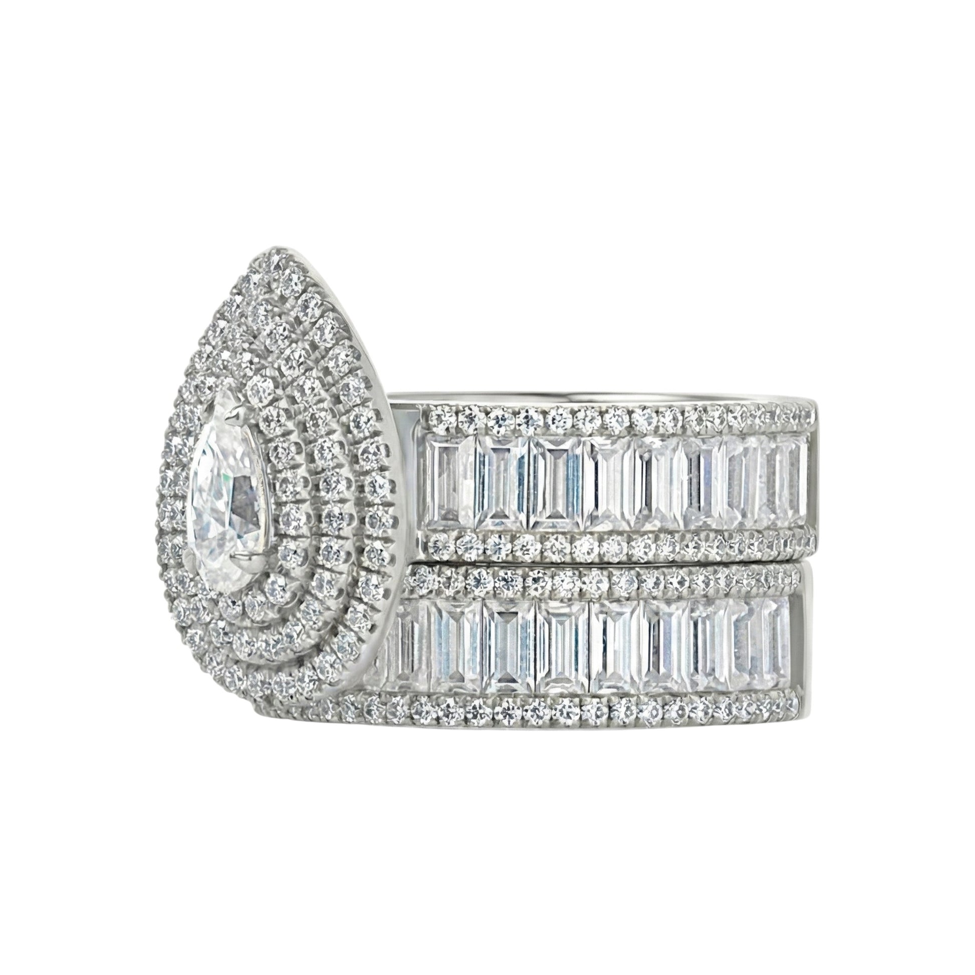 Diamond ring with a large central gemstone and smaller stones on a white background