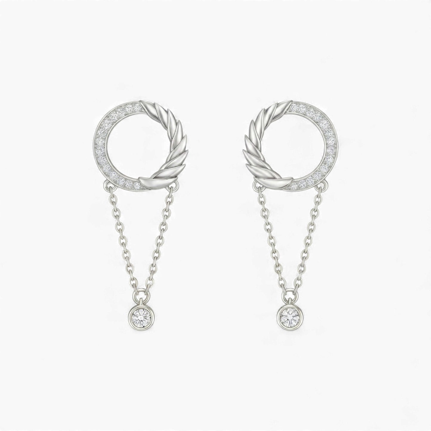 Pair of silver hoop earrings with chain drops on a white background