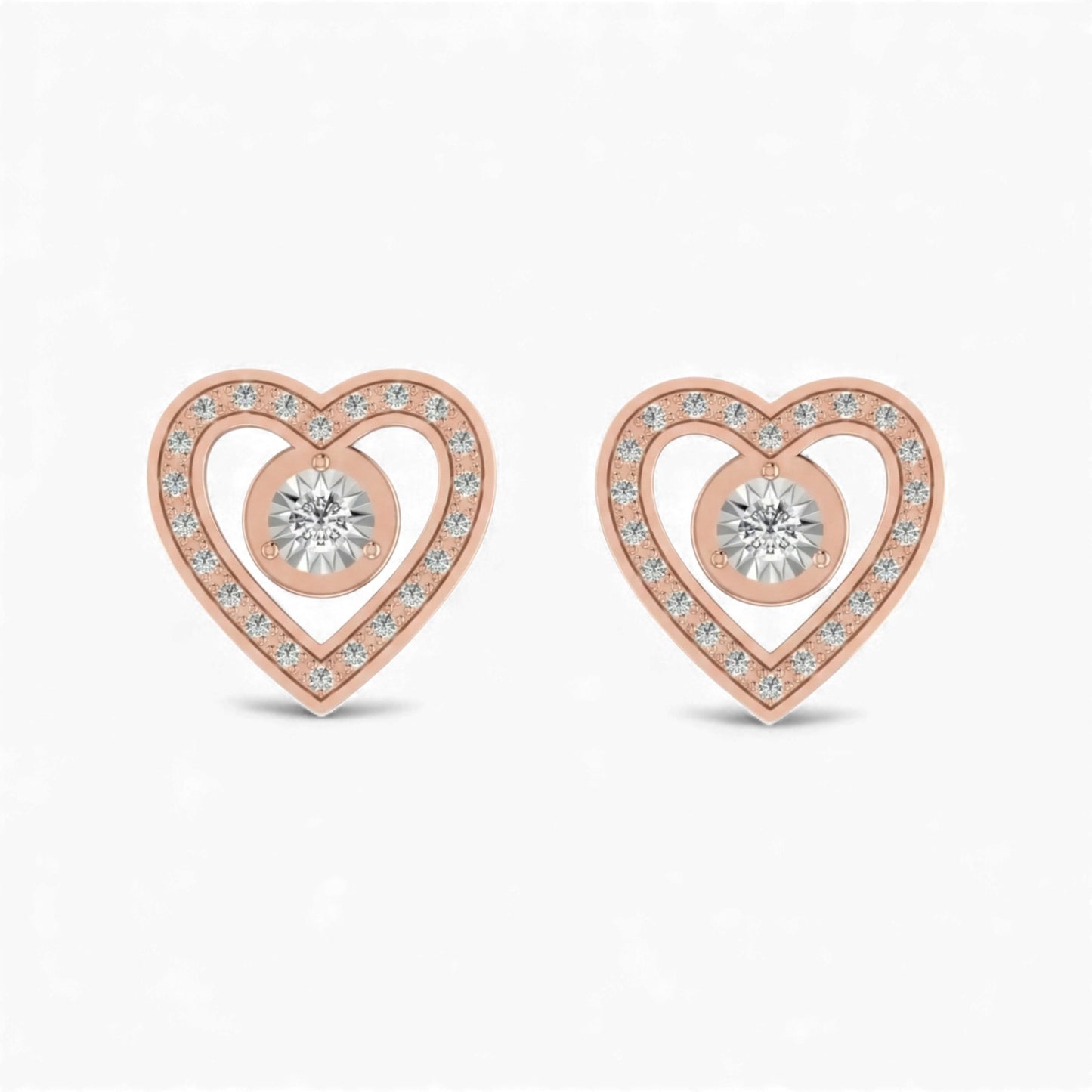 Rose gold heart-shaped earrings with clear gemstones on a white background
