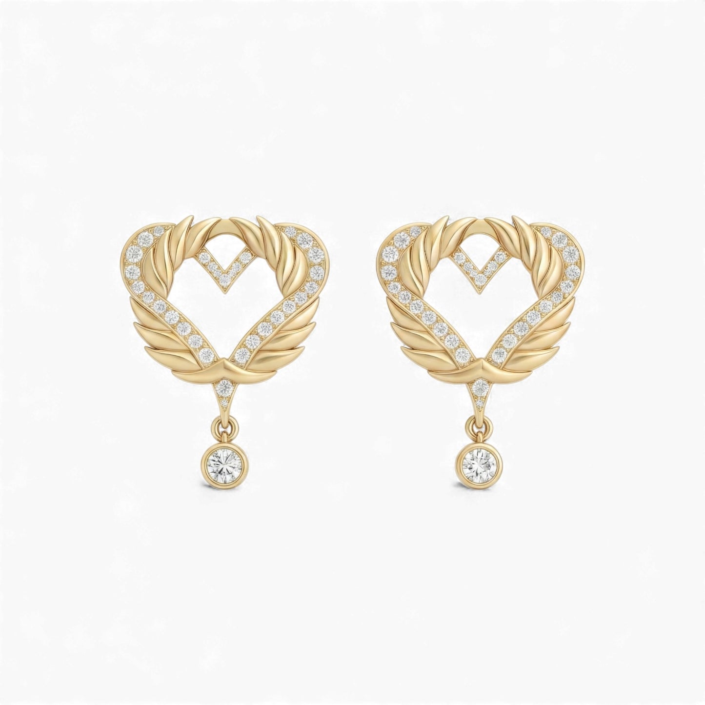 Gold heart-shaped earrings with diamond accents on a white background