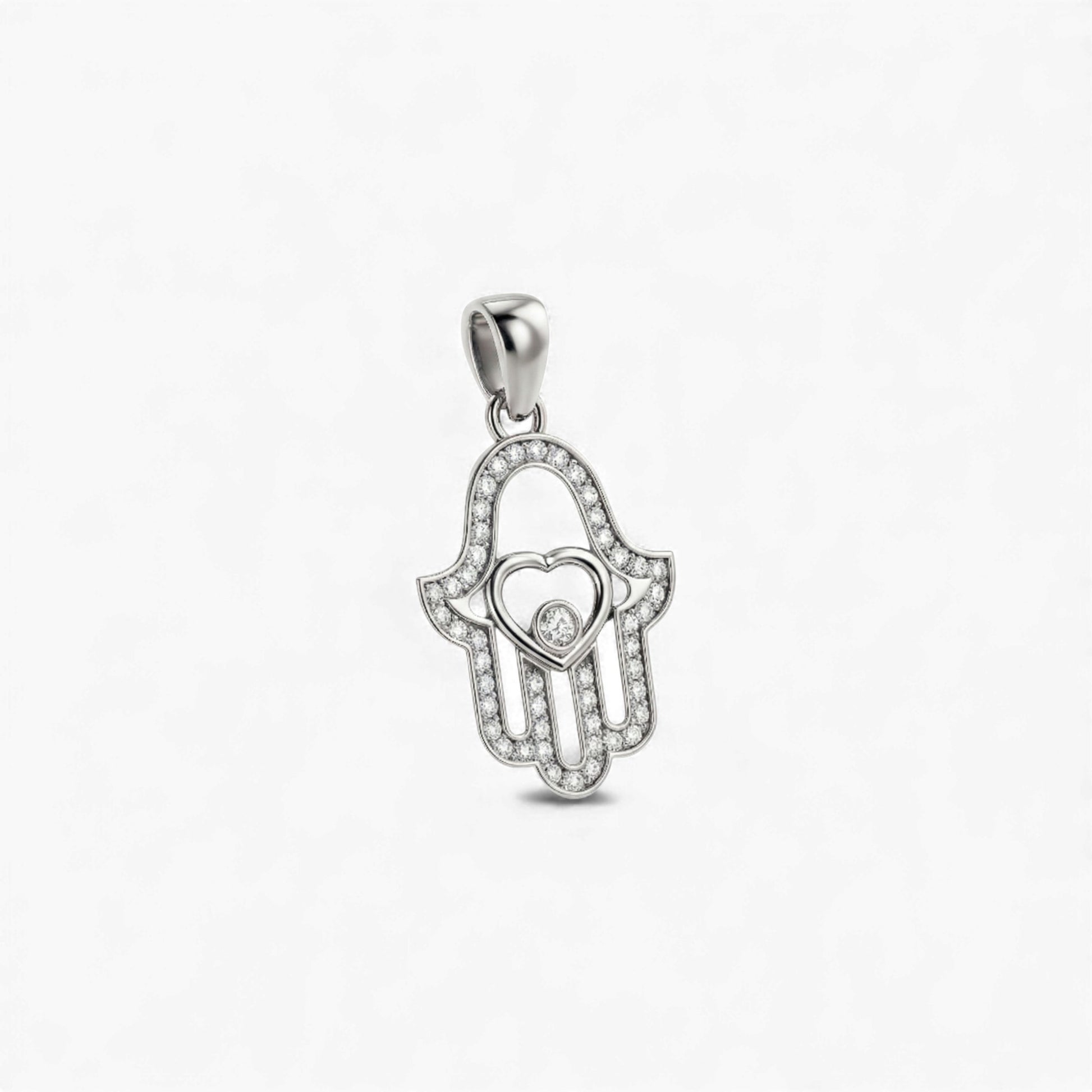 Silver pendant shaped like a hand with a heart in the center on a white background