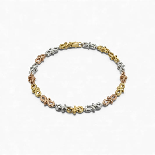 Tri-color bracelet with floral designs on a white background