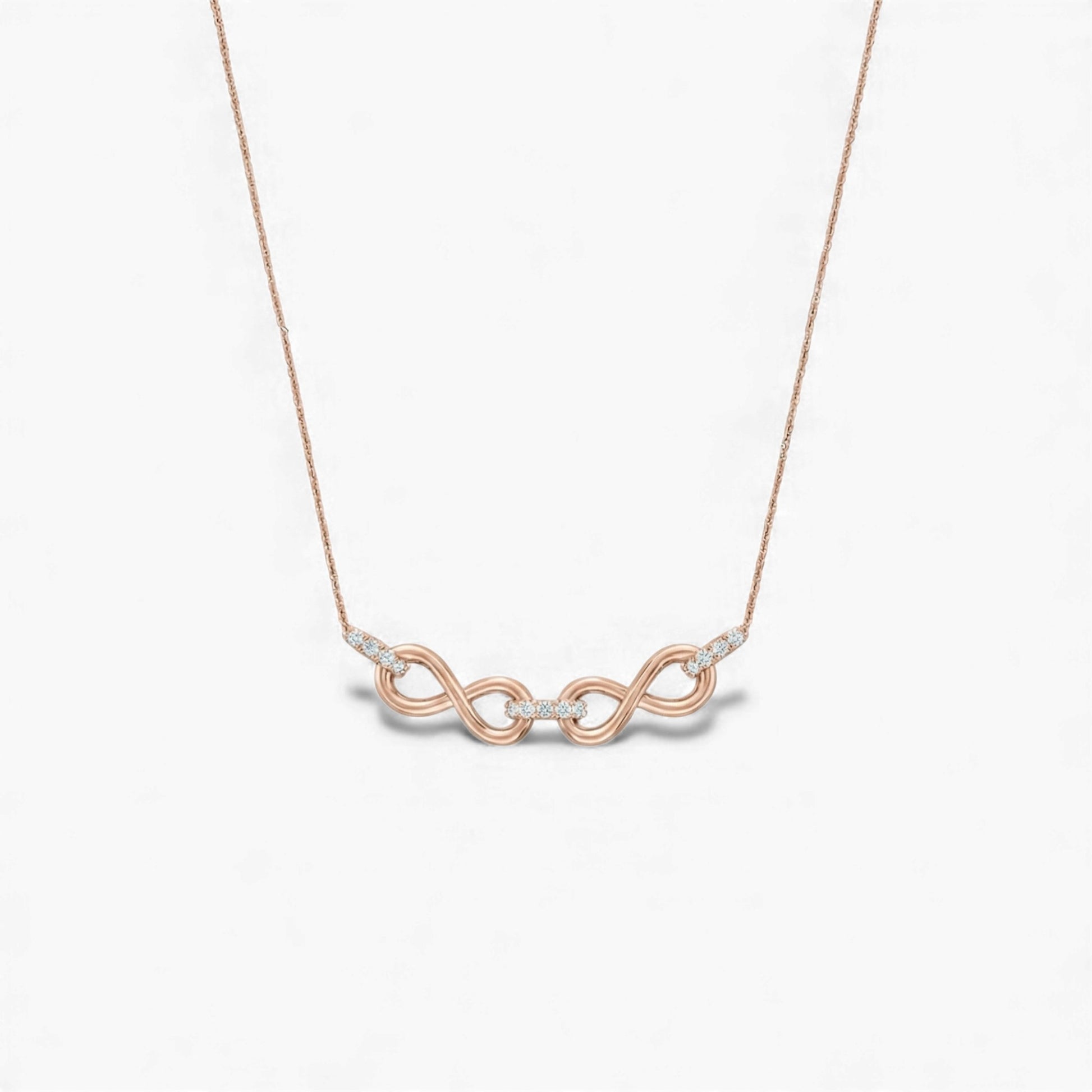 Rose gold necklace with a unique pendant on a light gray background