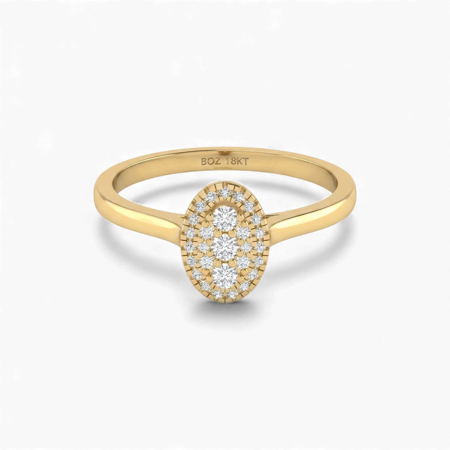 Gold ring with diamond oval design on a white background