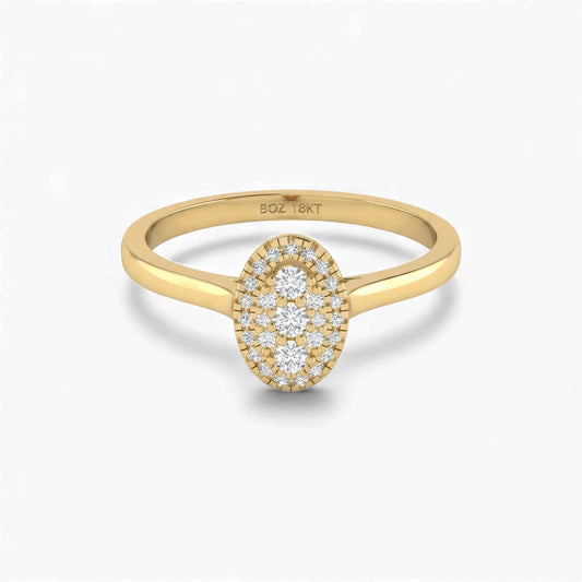 Gold ring with diamond oval design on a white background