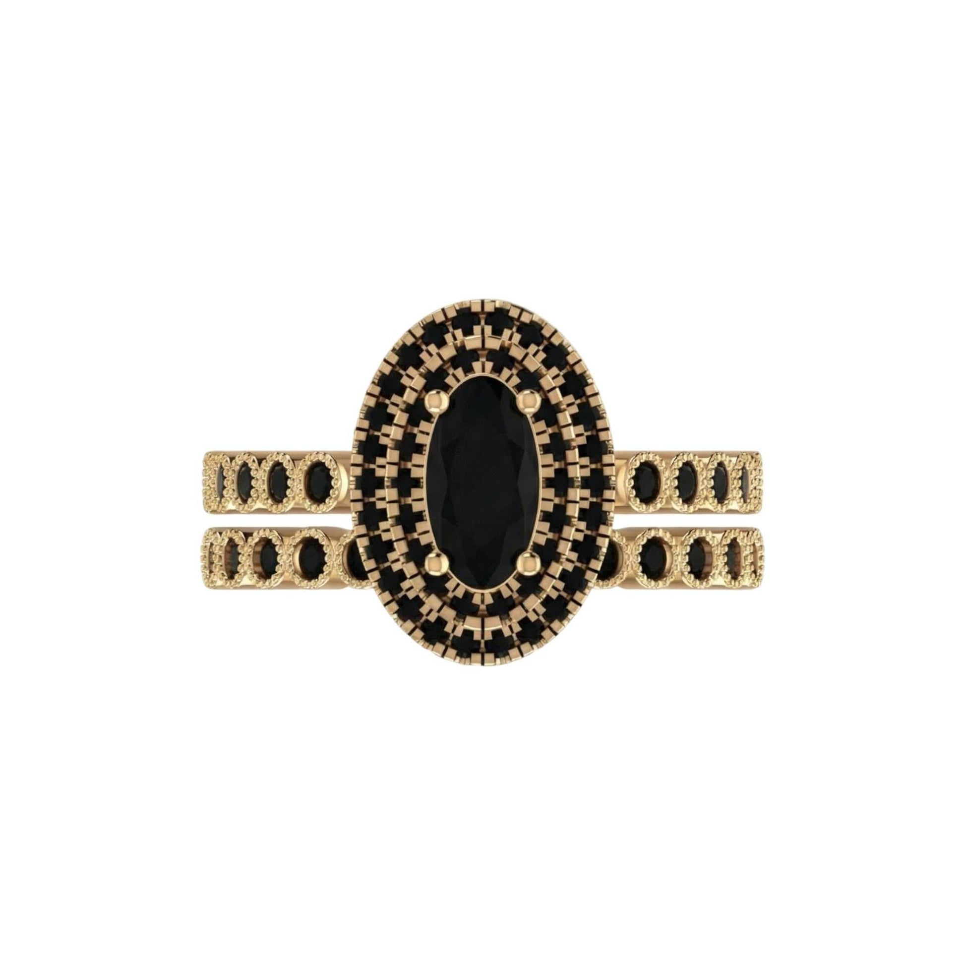 Gold ring with black gemstone on a white background