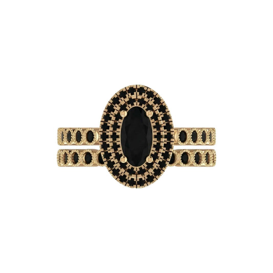 Gold ring with black gemstone on a white background