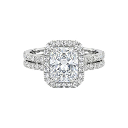 Diamond ring with a square-cut center stone on a white background