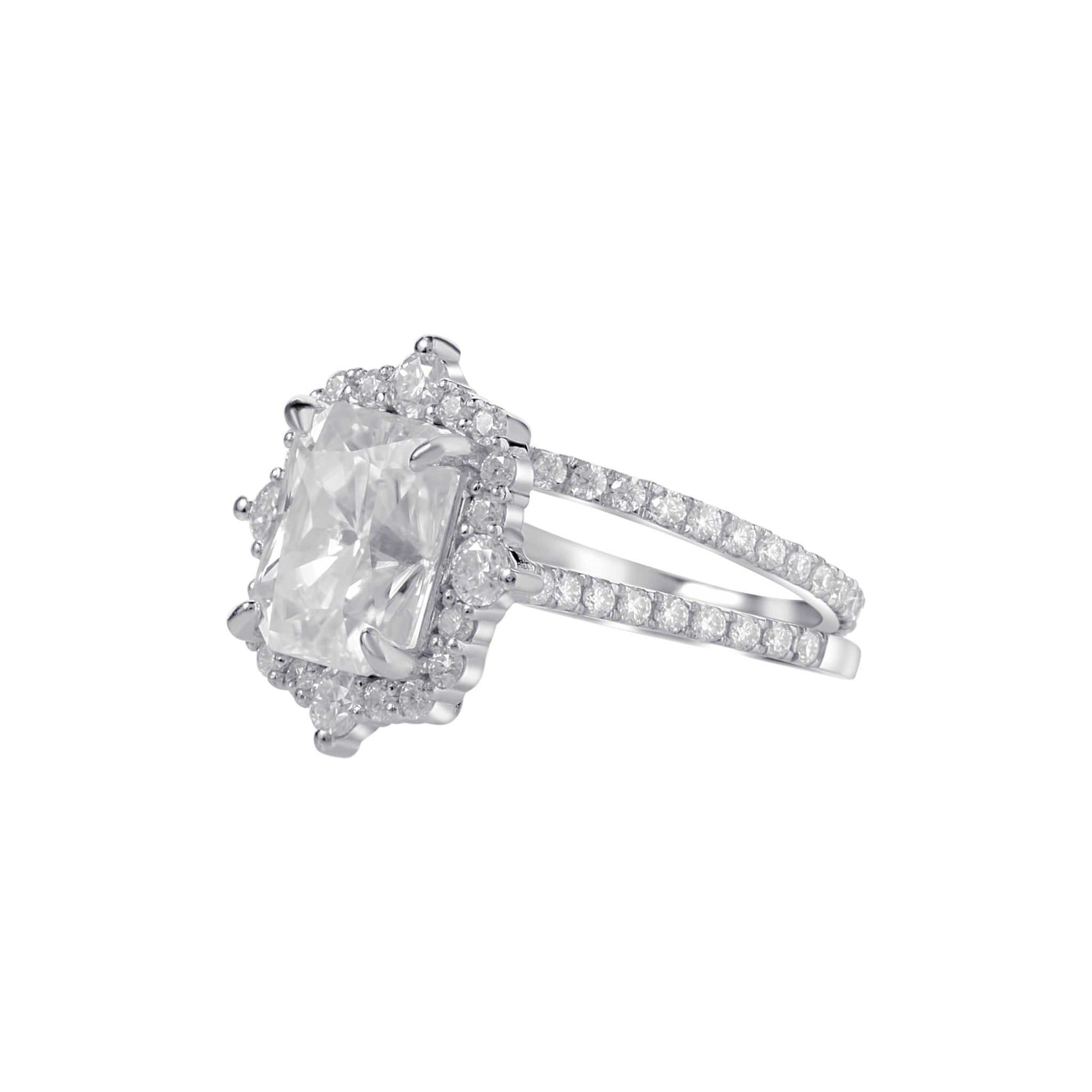 Diamond ring with a large central gemstone and smaller stones on a white background