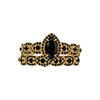 Gold bracelet with black gemstones on a white background